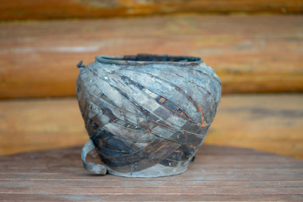istock old clay pot in birch bark on the table 1148900958