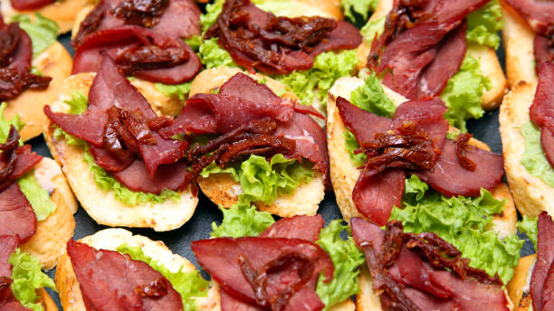 istock fresh sandwiches with ham and herbs on the table 1148901457