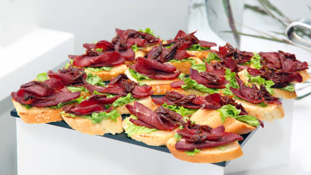 istock fresh sandwiches with ham and herbs on the table 1148901534