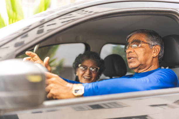 istock Senior man driving a car 1148903842