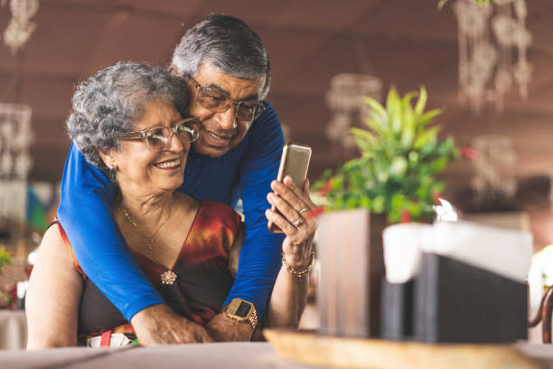 senior couple taking a selfie in restaurant - couple restaurant day south america imagens e fotografias de stock