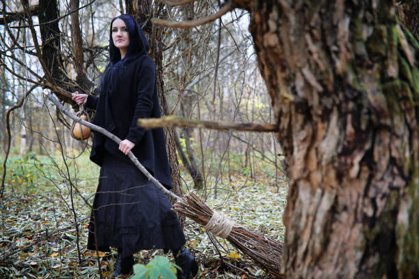 istock A woman in a witch suit in a forest 1148903989