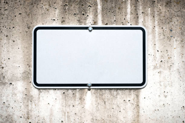 istock blank sign on wall mock-up -  parking spot sign mockup - 1148904087