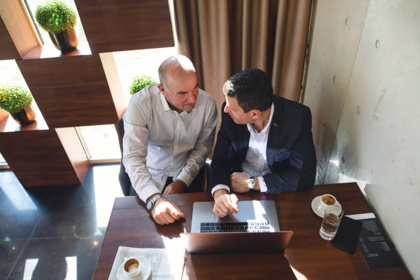 istock Senior men making business plans at a cafe 1148907256