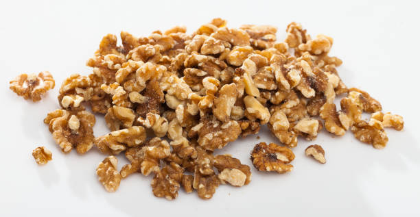 istock Close up of  raw peeled walnut on white background 1148907285