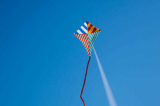 istock Colorful kite flying with waving red bow 1148910421