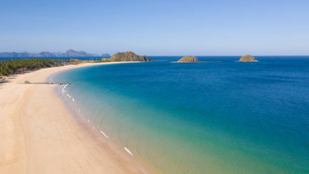 istock Tropical beach with white sand and turquoise lagoon 1148910604