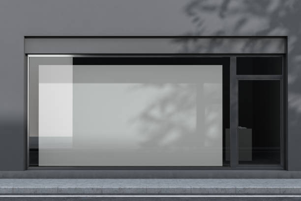 esterno dell'ufficio grigio con poster - facade foto e immagini stock