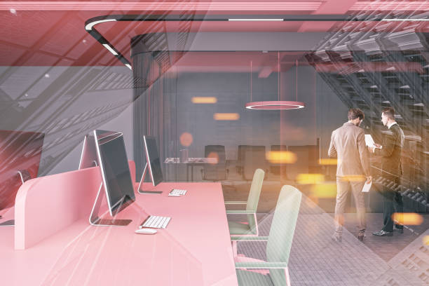 istock Businessmen in open space office with meeting room 1148915580