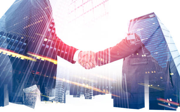 istock Handshake in modern city, partnership 1148915625