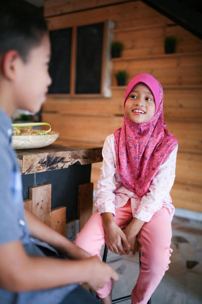 istock Two kids talking to each other 1148922444