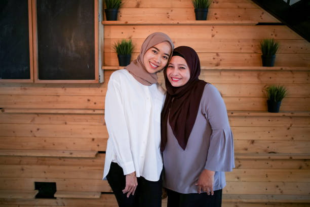 istock Mother and daughter smiling 1148923561