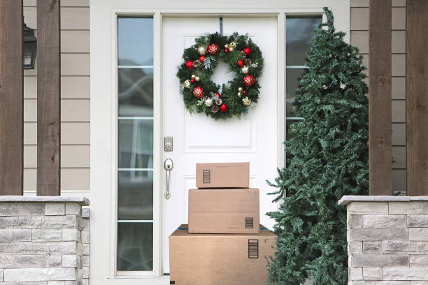 Christmas Wreath Front Door Packages front door with christmas wreath and packages porch photos stock pictures, royalty-free photos & images