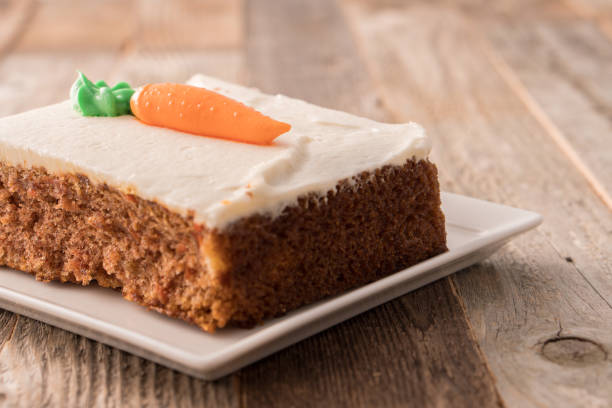 istock Carrot cake slice with frosting carrot topper 1148925412