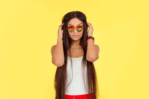 istock young woman with beautiful looking at camera adjusting touching long black hair extensions 1148927799