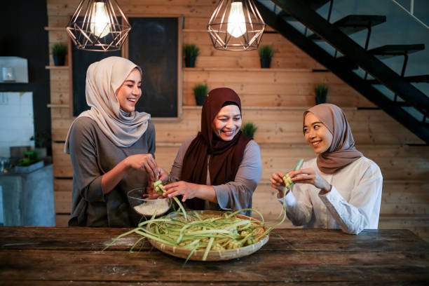 istock Mother with two daughter preparing food in kitchen 1148937561