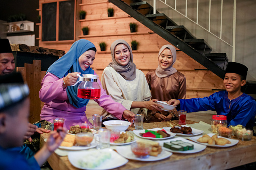 Family gathering and eat together while iftar during ramadhan in Malaysia