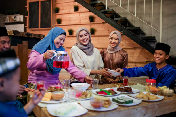 Family gathering and eat together Family gathering and eat together while iftar during ramadhan in Malaysia traditional malaysian food stock pictures, royalty-free photos & images