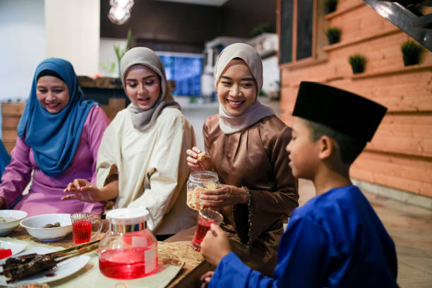 Family gathering and eat together Family gathering and eat together while iftar during ramadhan in Malaysia traditional malaysian food stock pictures, royalty-free photos & images