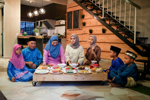 Family gathering and eat together Family gathering and eat together while iftar during ramadhan in Malaysia traditional malaysian food stock pictures, royalty-free photos & images