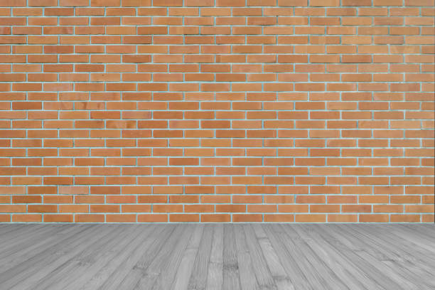 istock Dark orange brown brick wall texture background with wooden floor in grey 1148939061