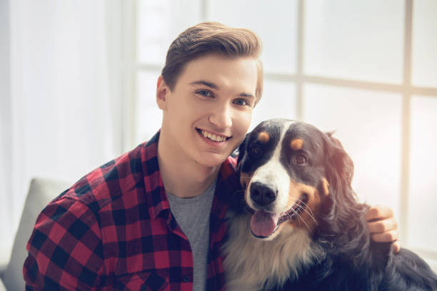 istock Young person with dog at home leisure 1148939708