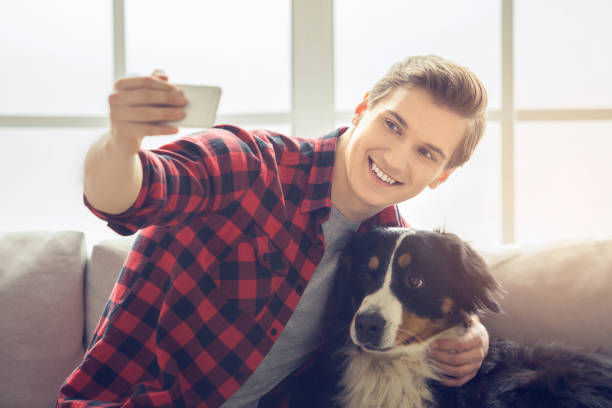 istock Young person with dog at home leisure 1148939710