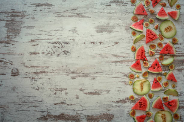 Sliced watermelon, figs and melons border