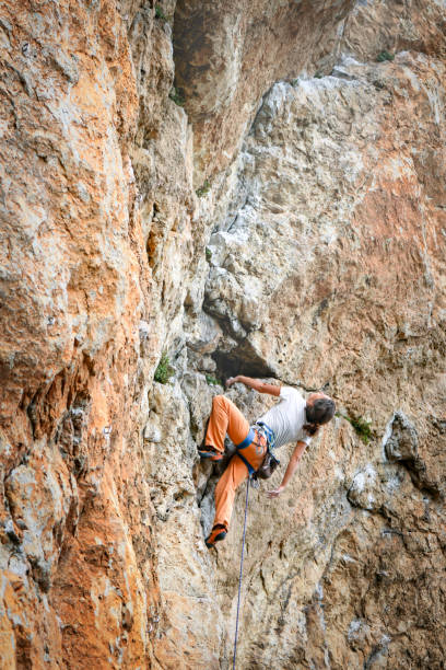 istock Woman climbs mountain. 1148976680