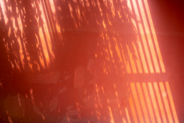 Red wall with shadow for abstract background. Vintage and retro backdrop.