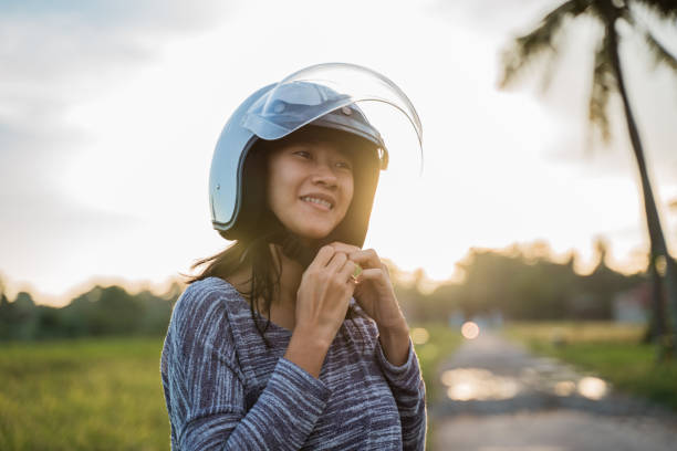 istock woman wearing helmet 1148980334