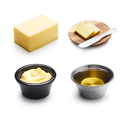 Butter, margarine and oil isolated on white background