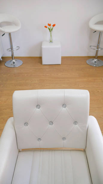 istock White chairs in a white saloon 1148987209