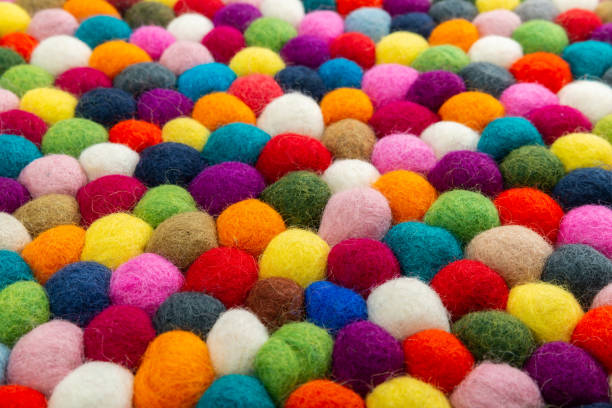 istock Multicolored felt ball rug detail 1148987252