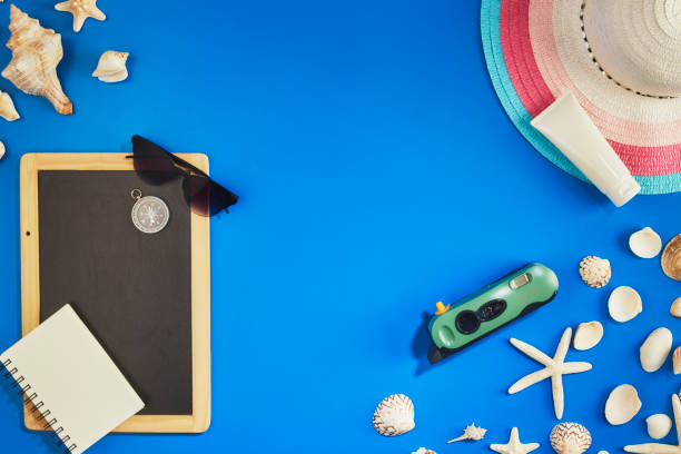 istock Frame Summer travel accessories on blue background copy space 1148988350