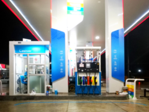 The Lighting Blurred in Gas station at night for background.