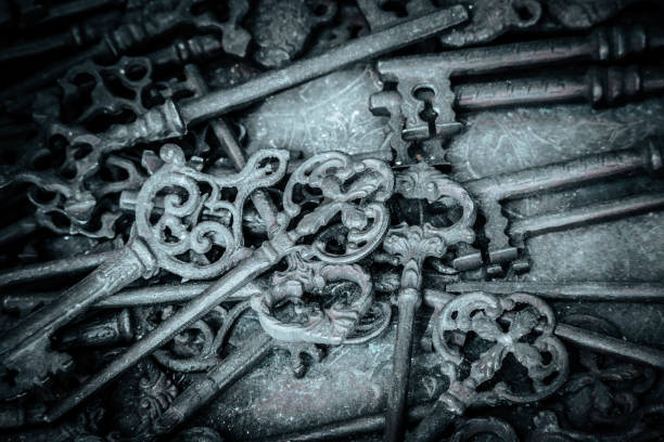 Many old keys in a dust. Mystery background concept.