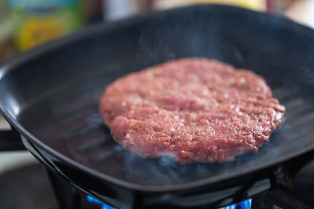istock Beef and pork burger at hot frying pan 1148990398