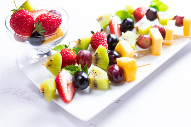 istock Ripe fruit in season on skewers 1148990933