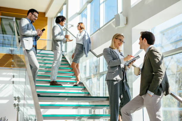istock Two business people discussing report on stairs 1148991072