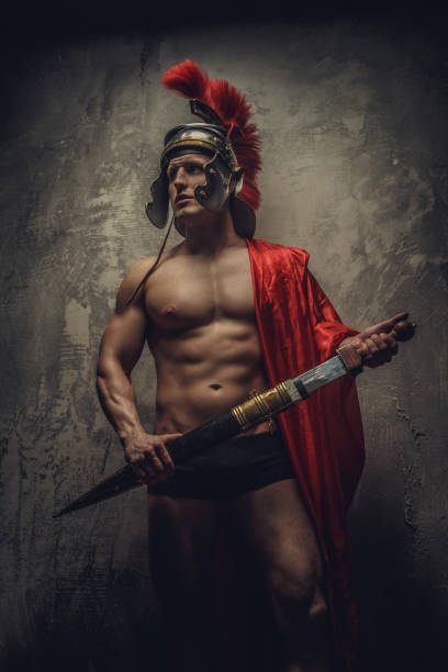 istock A man in a Roman clothes with sword. 1148991786