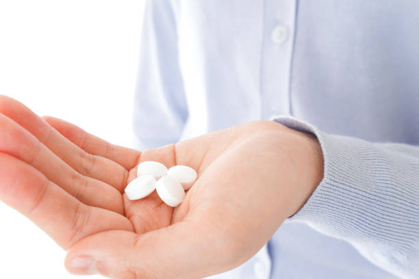 istock Young woman taking medicine, supplements 1148991801