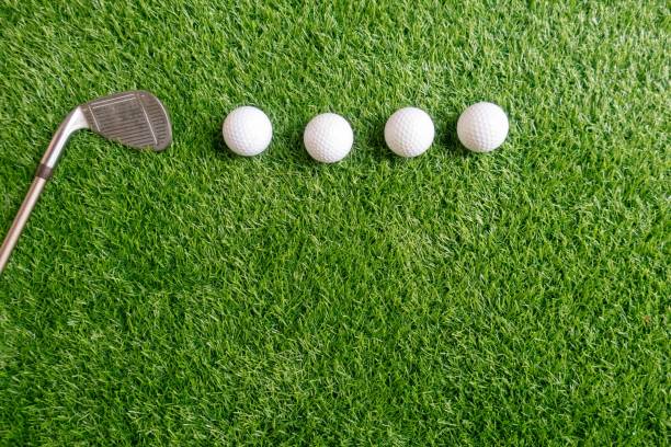 istock Golf balls are on green grass background 1148991956