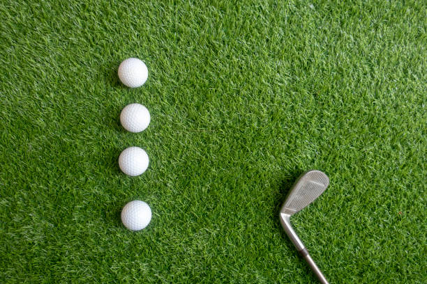 istock Golf balls are on green grass background 1148991968