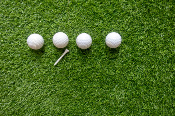 istock Golf balls are on green grass background 1148991969