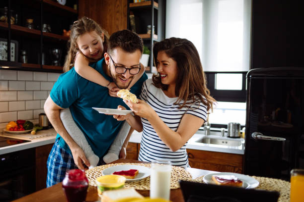 istock Family at home starting their day in the kitchen 1148992038