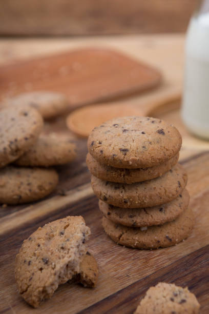 istock Stacked chocolate chip cookie on wooden table 1148992215