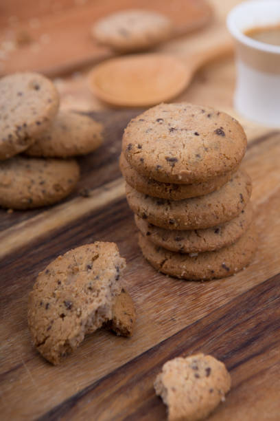 istock Stacked chocolate chip cookie on wooden table 1148992223
