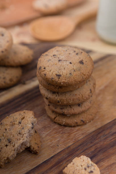 istock Stacked chocolate chip cookie on wooden table 1148992251