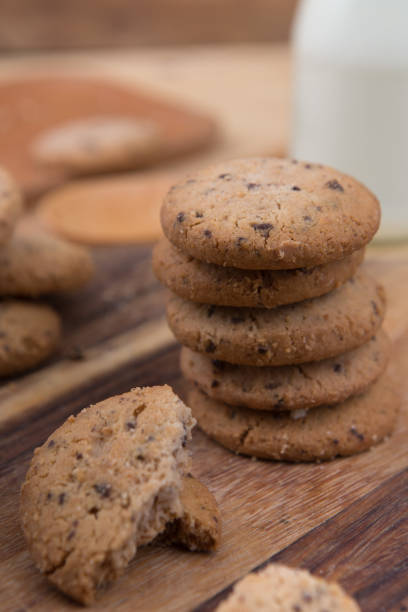 istock Stacked chocolate chip cookie on wooden table 1148992256